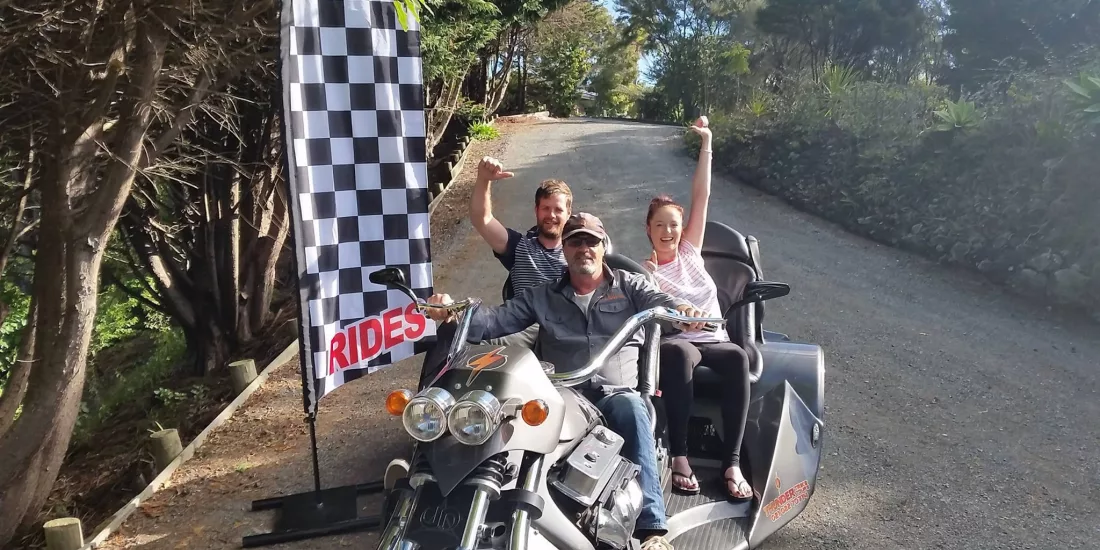 Riders posing on a Thunder Trike before starting their Bay Combo experience