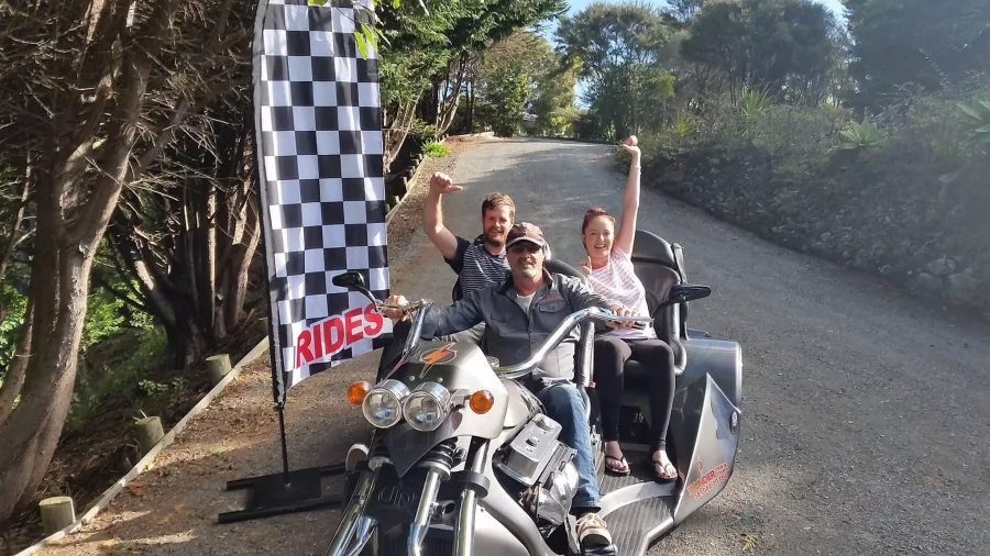 Riders posing on a Thunder Trike before starting their Bay Combo experience