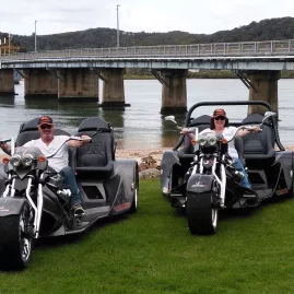 Thunder Trike riders parked by the bridge in Paihia, Bay of Islands