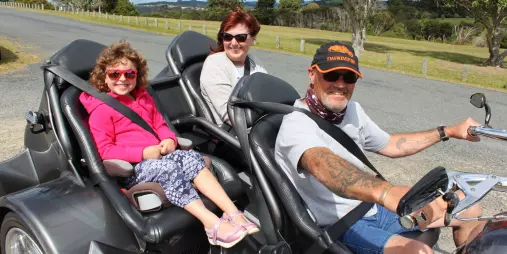 Family on a Thunder Trike tour with guide in the Bay of Islands, New Zealand
