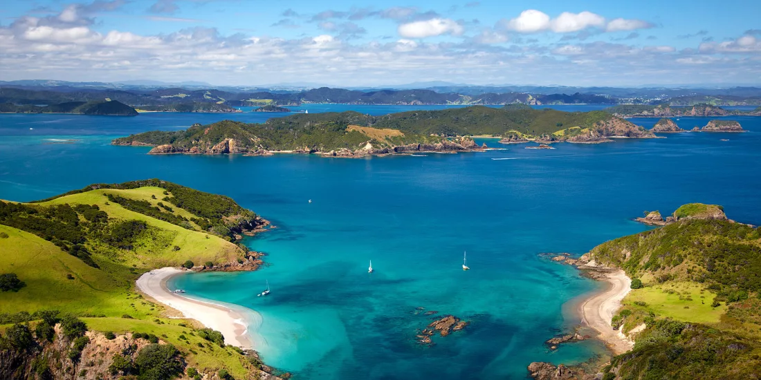 Panoramic coastal view of the Bay of Islands with scattered islands and turquoise water