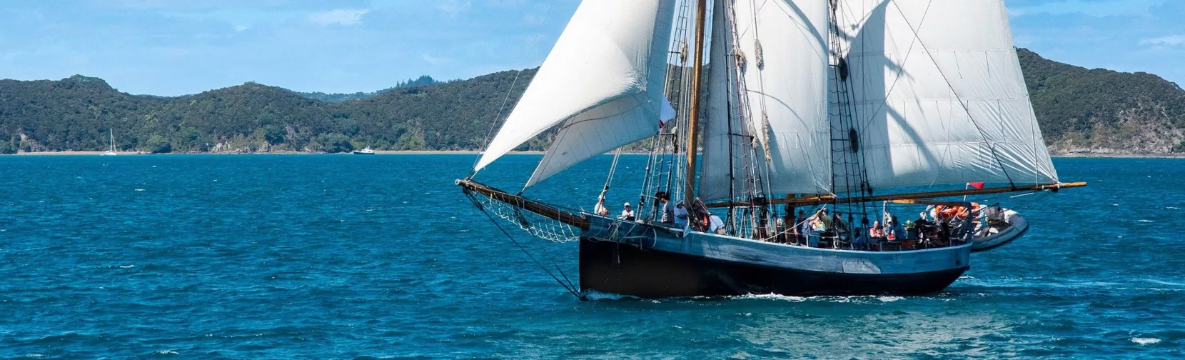 Classic sailing ship cruising through the Bay of Islands near Paihia