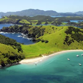 Coastal view of the Bay of Islands with sparkling blue water and lush island landscapes