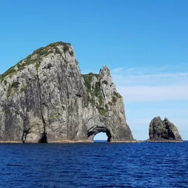 Piercy Island with the famous Hole in the Rock formation in the Bay of Islands