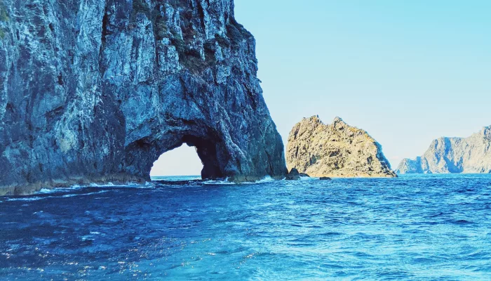 Scenic view of the Hole in the Rock formation in the Bay of Islands, Northland