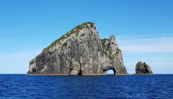 Piercy Island with the famous Hole in the Rock formation in the Bay of Islands