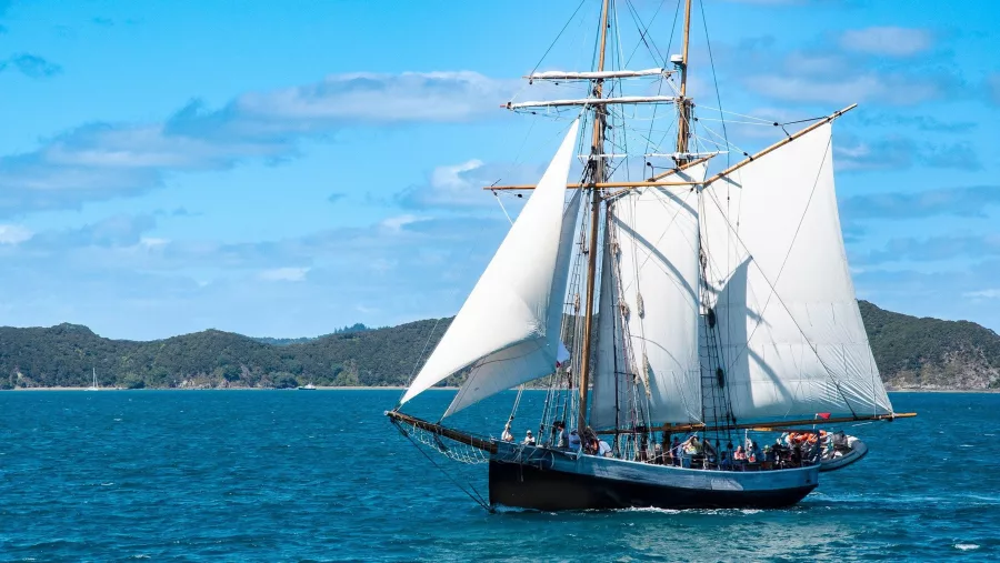 Classic sailing ship cruising through the Bay of Islands near Paihia