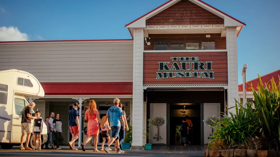 Group of visitors arriving at The Kauri Museum entrance in Matakohe
