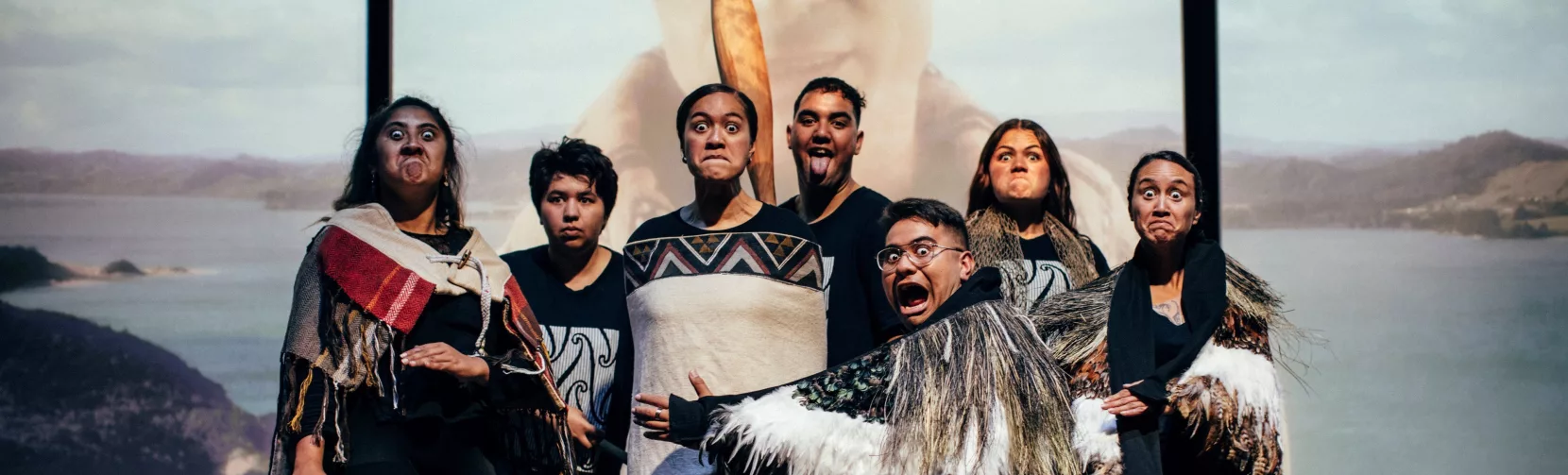 Group of Māori performers expressing traditional haka and facial gestures at Manea Footprints of Kupe in Hokianga