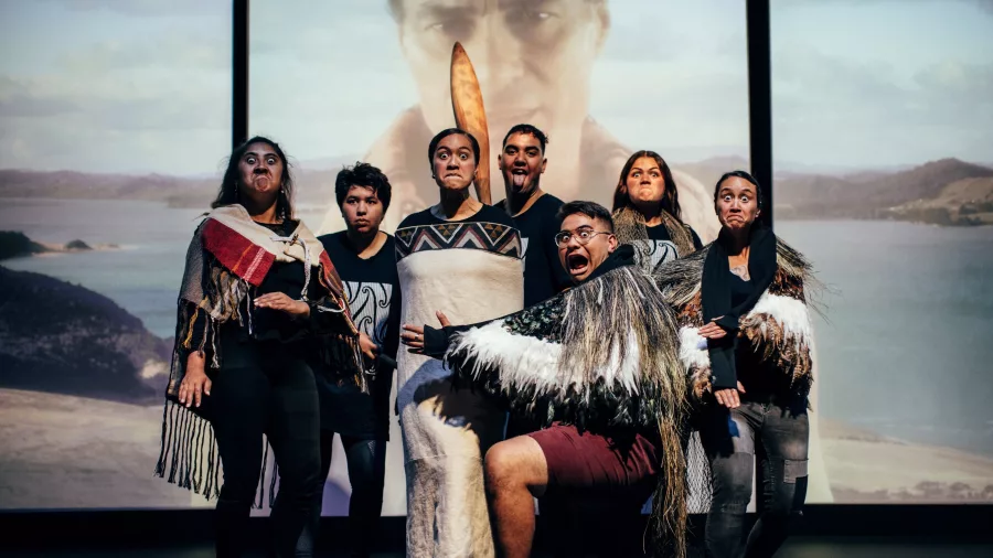 Group of Māori performers expressing traditional haka and facial gestures at Manea Footprints of Kupe in Hokianga