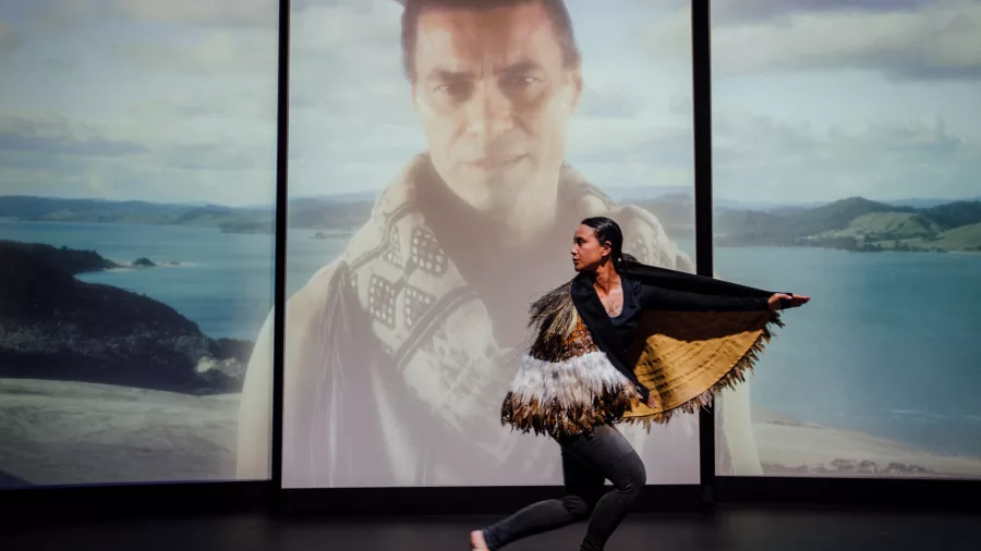 Performer wearing a traditional Māori kakahu during a cultural dance at Manea Footprints of Kupe in Hokianga