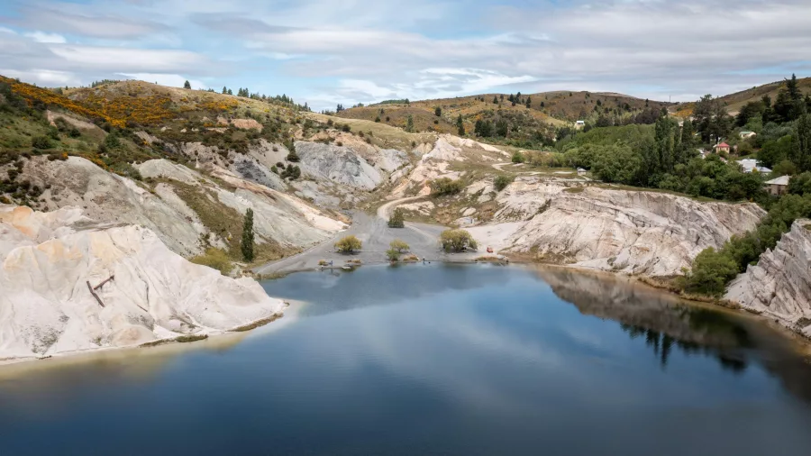 Crystal blue waters and white cliffs at Blue Lake, St Bathans