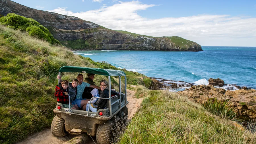 Family on 4WD tour along Otago Peninsula coastline on Nature's Wonders Tour