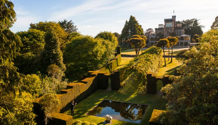 Aerial view of Larnach Castle and its formal gardens on Otago Peninsula in Dunedin.