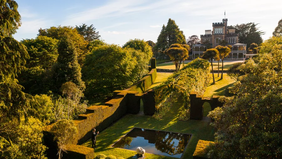 Aerial view of Larnach Castle and its formal gardens on Otago Peninsula in Dunedin.
