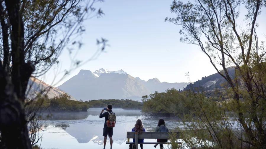 Family enjoying the mountain view from Glenorchy Lagoon’s boardwalk lookout.