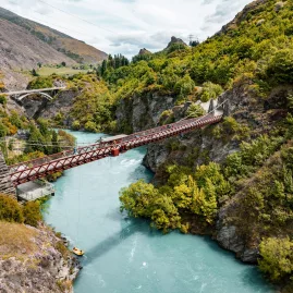 Suspension bridge spanning the Kawarau Gorge over turquoise water