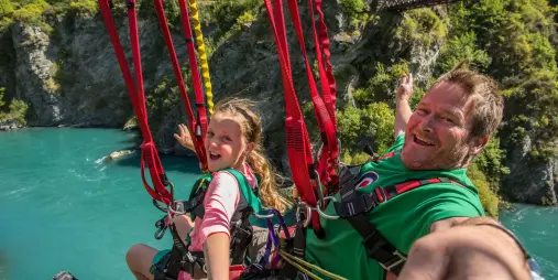 Father and daughter riding the Kawarau Zipride in Queenstown