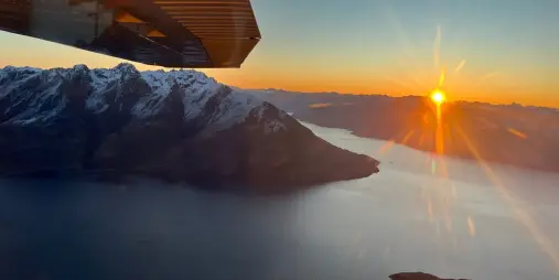 Sunset over Lake Wakatipu seen from Air Milford golden hour scenic flight