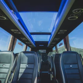 Interior of a premium glass-roof coach used on a Milford Sound tour from Queenstown