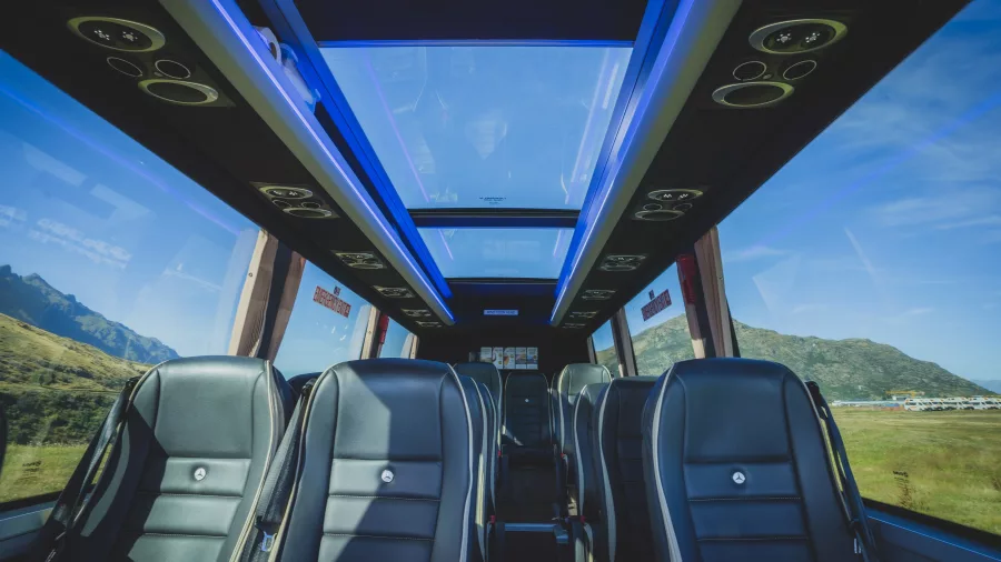 Interior of a premium glass-roof coach used on a Milford Sound tour from Queenstown