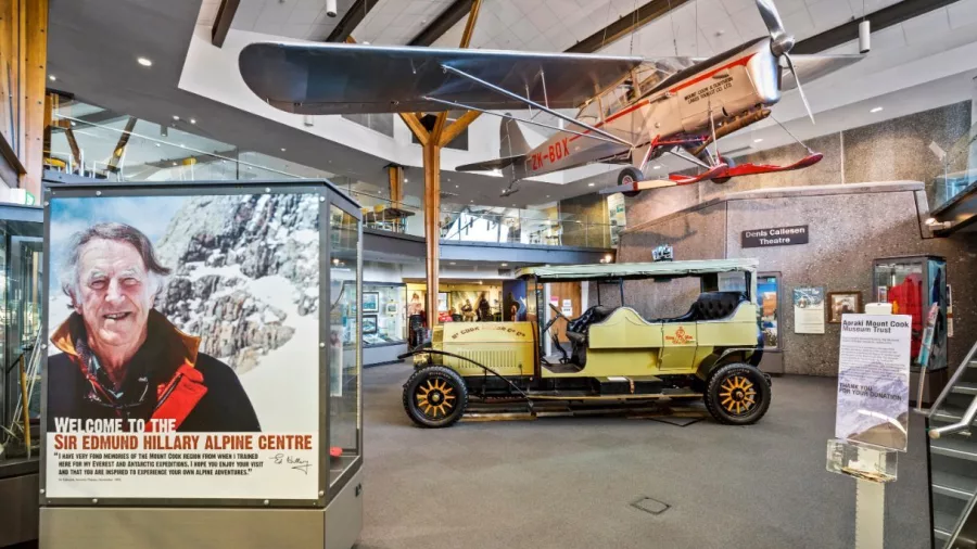 Interior of the Sir Edmund Hillary Alpine Centre museum with vintage vehicles and aircraft displays.
