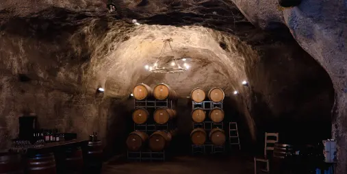 Wine barrels stored in the Gibbston Valley underground cellar