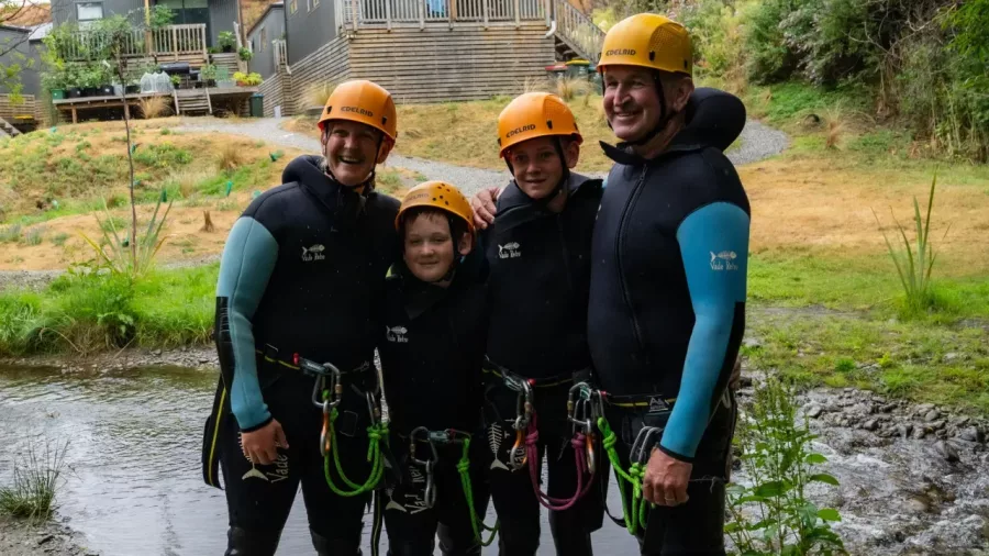 Family posing before canyoning tour at Camp Creek