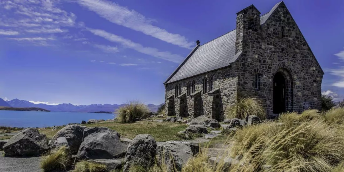 Stone Church of the Good Shepherd with views over Lake Tekapo and the Southern Alps in the background