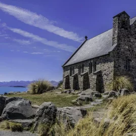Stone Church of the Good Shepherd with views over Lake Tekapo and the Southern Alps in the background