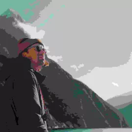 Smiling passengers soaking in the Milford Sound views with forested peaks in the background.