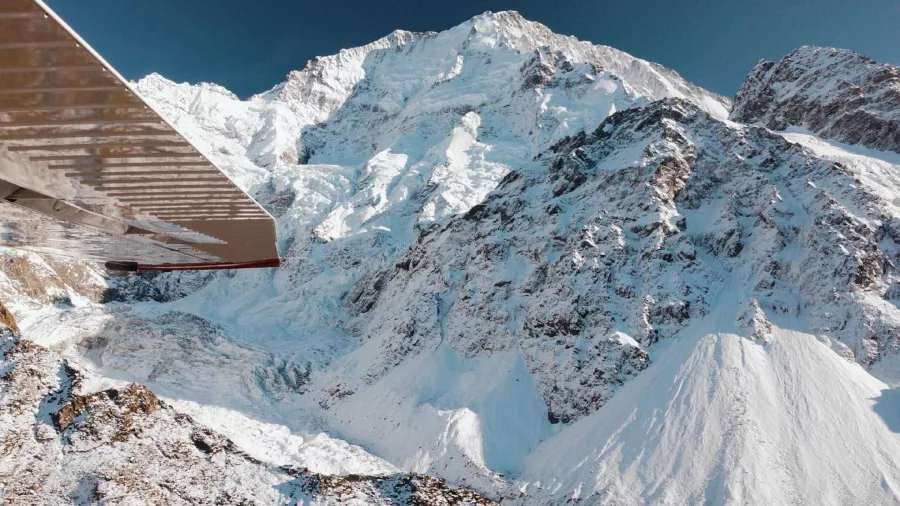 Wing view of Glenorchy Air flight approaching Mount Cook and the Southern Alps