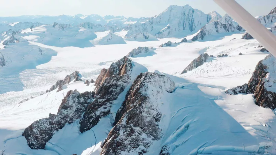 Aerial view of glaciers and snow-covered peaks in the Southern Alps