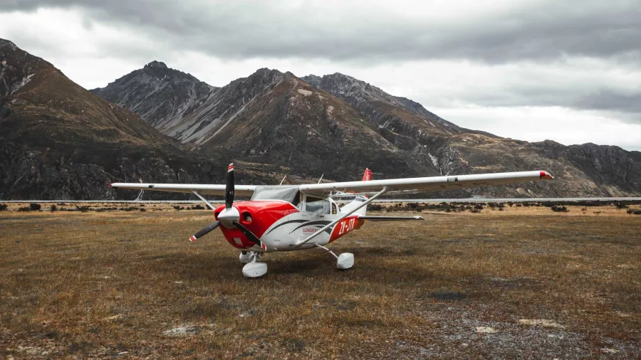 Glenorchy Air aircraft parked at Mount Cook Airfield with alpine backdrop