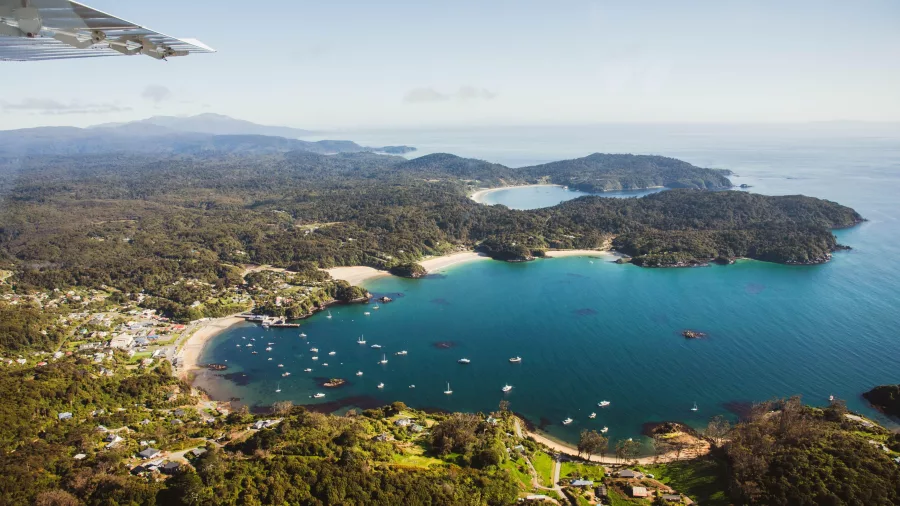 Aerial view of Oban township on Stewart Island with clear turquoise waters