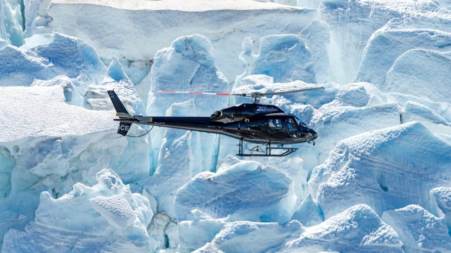 Helicopter gliding over a labyrinth of glacier ice in the Fiordland region