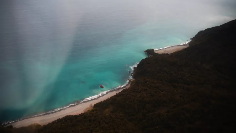 Aerial view of wild West Coast shoreline and turquoise waters