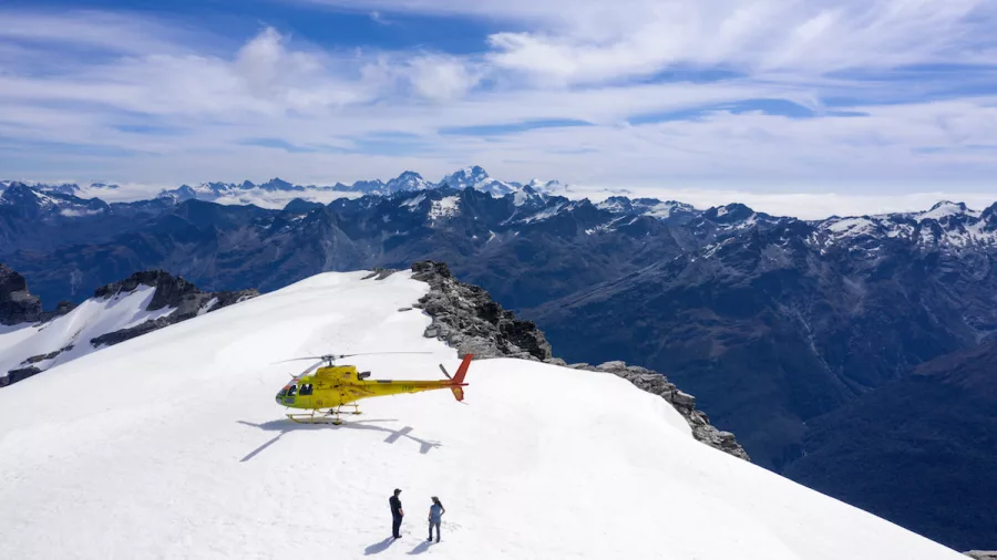Scenic helicopter snow landing in New Zealand's Southern Alps with panoramic views
