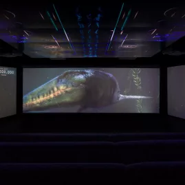 CGI underwater dinosaur displayed across three cinema screens at Time Tripper Queenstown