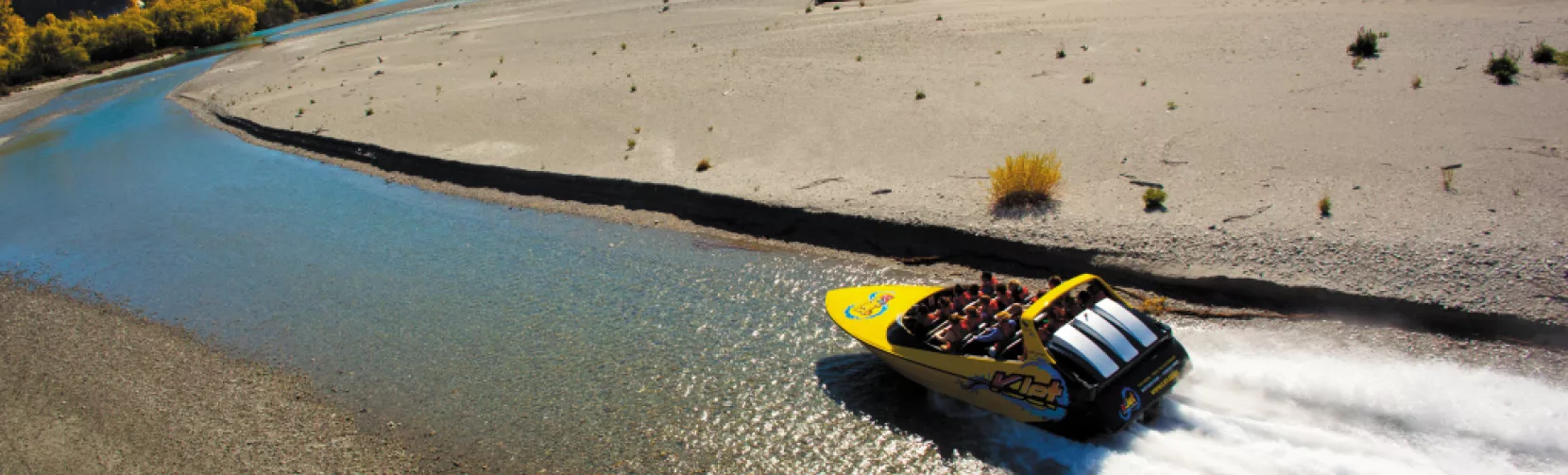 KJet boat navigating a tight bend on the Shotover River