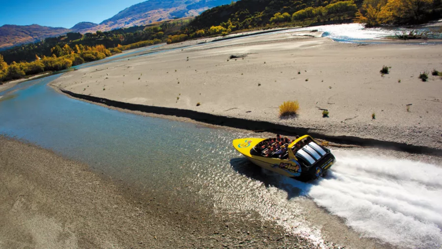 KJet boat navigating a tight bend on the Shotover River