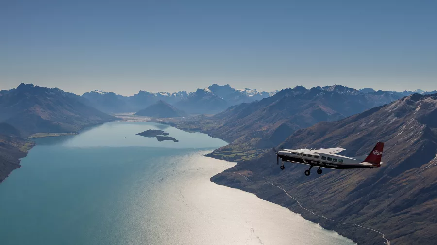 Scenic flight over Lake Wakatipu towards snow-capped Southern Alps