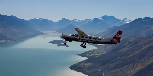 Plane flying above Lake Wakatipu on Milford Sound flight from Queenstown
