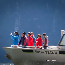 Passengers on Mitre Peak II boat taking in the scenery at Milford Sound