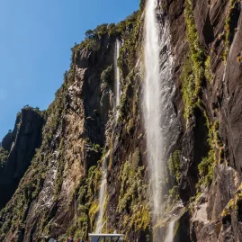 Cruise boat approaching Stirling Falls in Milford Sound