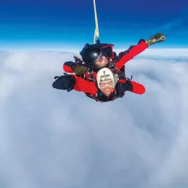 Tandem skydive freefall through the clouds above Queenstown