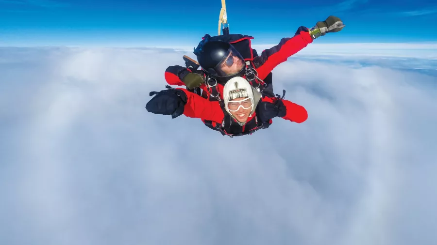 Tandem skydive freefall through the clouds above Queenstown