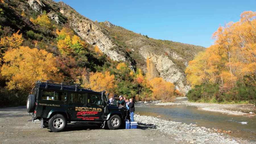 Tour group enjoying tea stop by the river on Queenstown LOTR safari