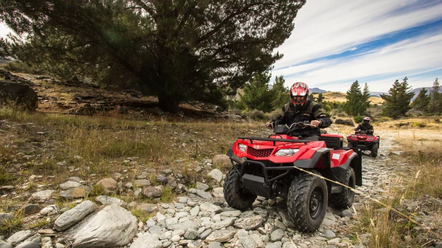 Quad bikes navigating rocky terrain on Queenstown Hill trail