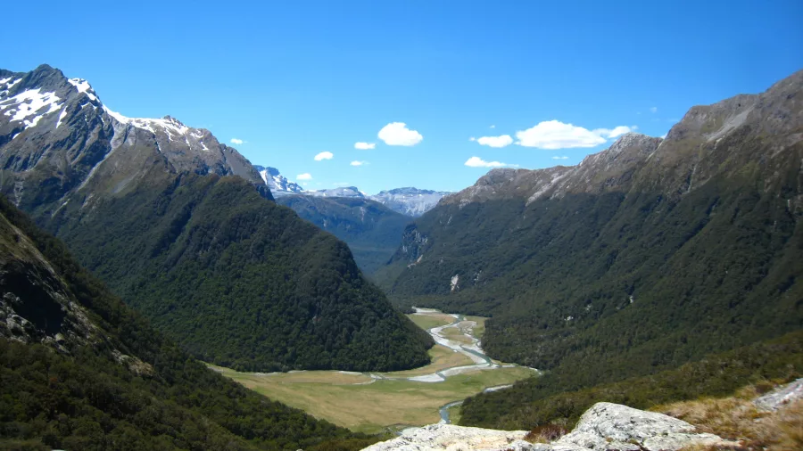 Expansive valley view with snow-capped mountains on Routeburn Track